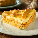Brazilian Chicken Pie – Homemade Chicken Pie on a Wooden Table Rustic Appeal.