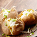 Baked Potato with chives, cheese, and sour cream